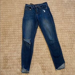 SP Black jeans with distressed knee and raw hem